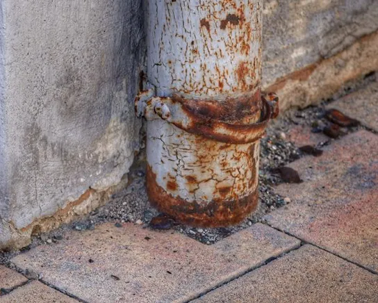 Corrosion on old plumbing, the same failure that ends a hot water cylinder