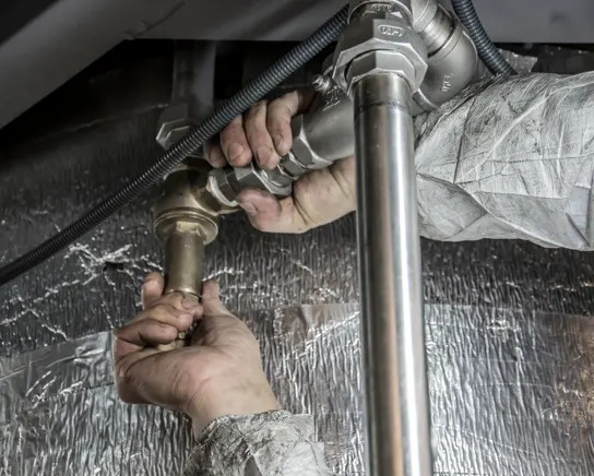 Testing the valves and connections on a hot water unit