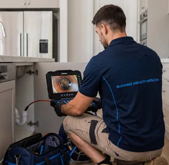 Licensed technician working from the van on a Parramatta job